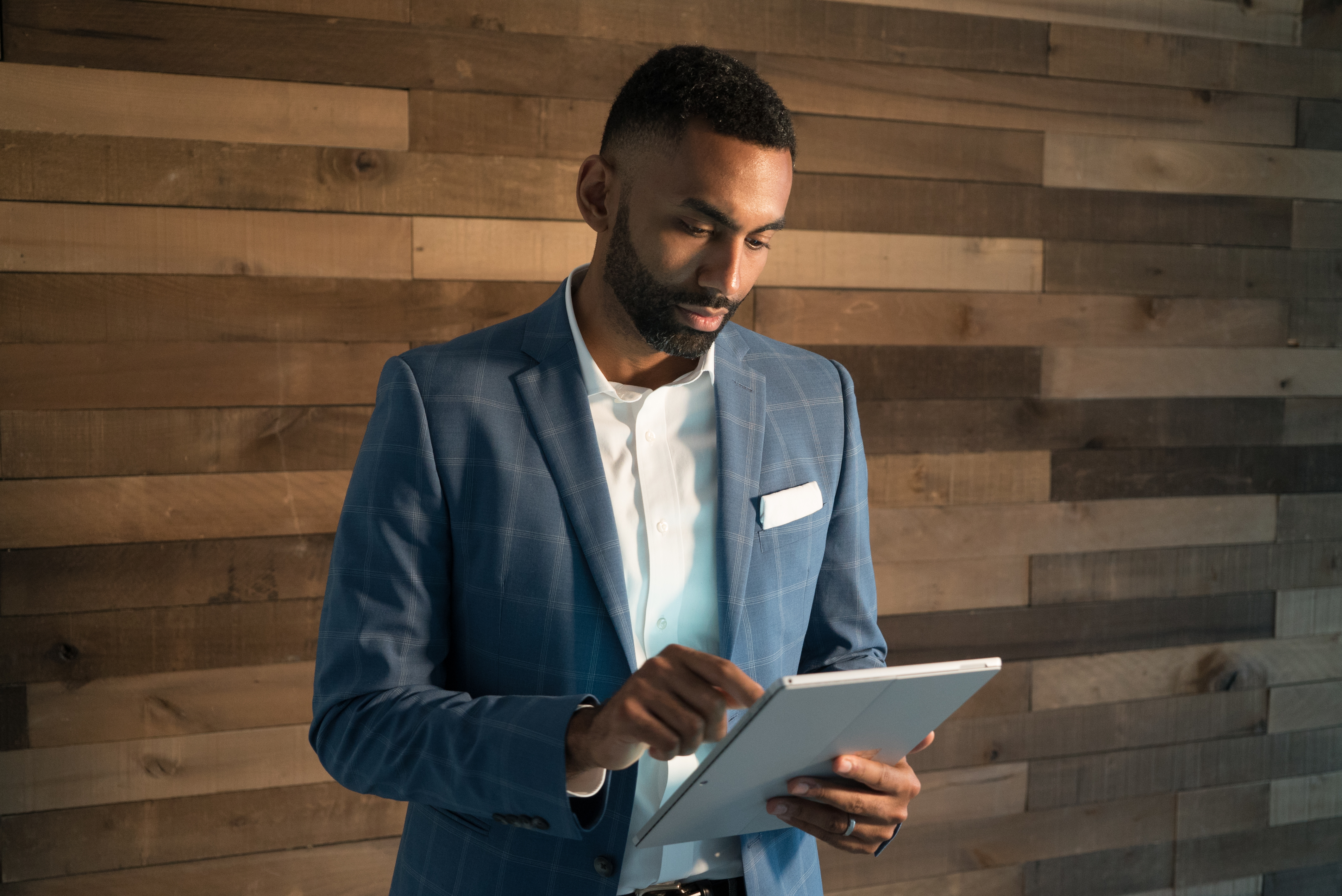Career Coach Juan using a tablet
