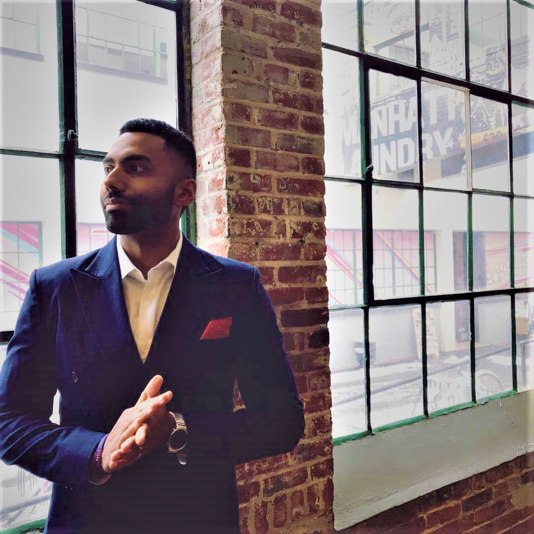 Career Coach Juan wearing a blue business suit